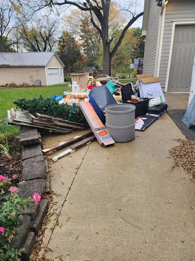 Dumpster being loaded with debris for Residential Dumpster Rental in City of Orange